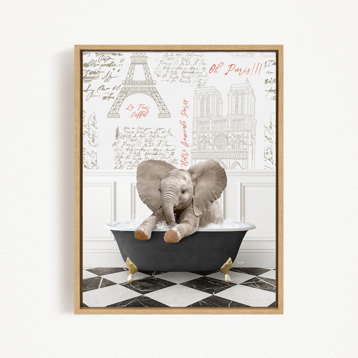 A framed image depicting a baby elephant sitting in a bathtub, with a Paris-themed background featuring the Eiffel Tower and other Parisian landmarks.