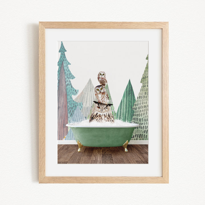 A framed image depicting a bird perched on a green bathtub, surrounded by stylized trees and a snowy landscape.