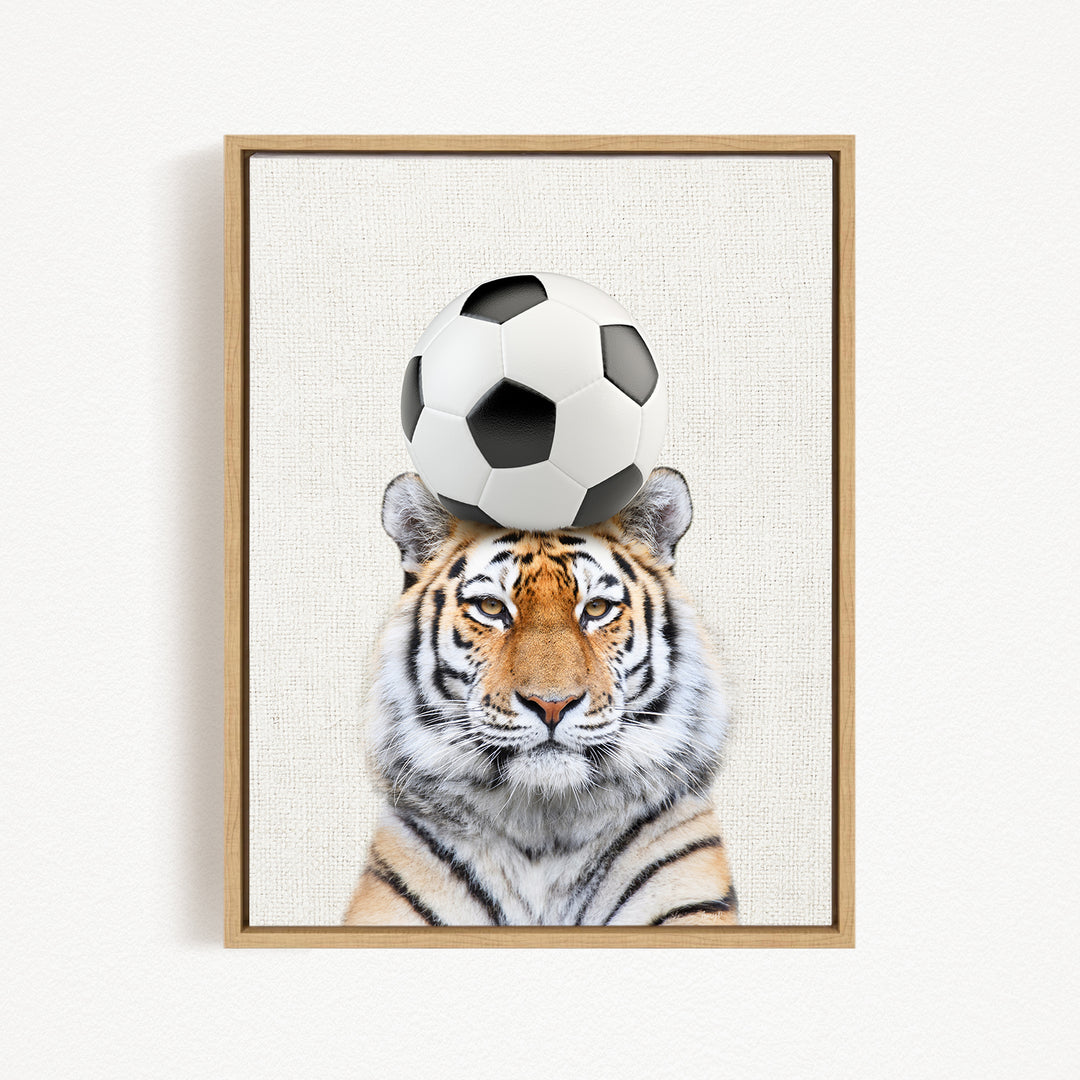 A tiger is depicted balancing a soccer ball on its head, creating a playful and amusing scene.