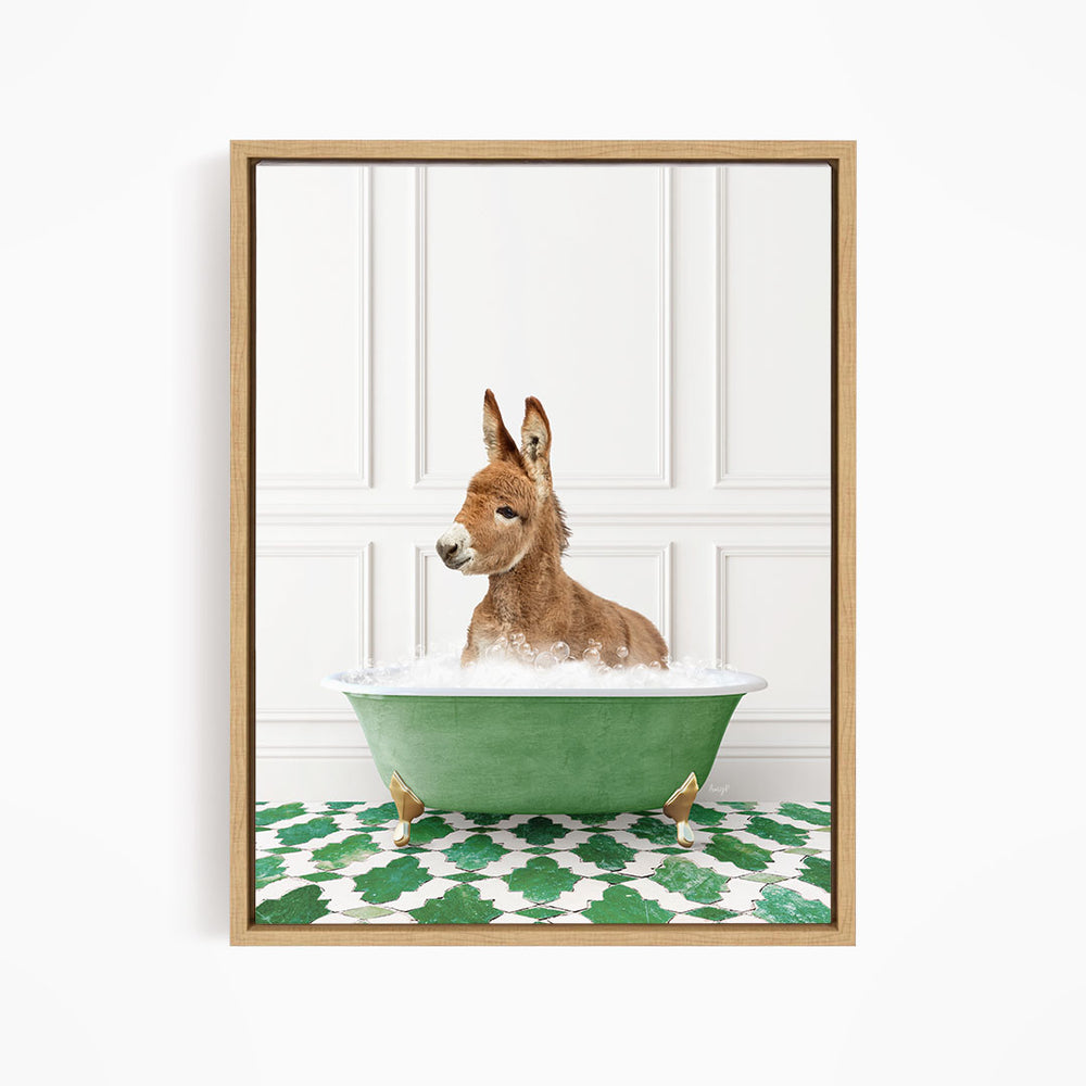 A donkey is sitting in a green bathtub filled with water, surrounded by a patterned green and white floor.