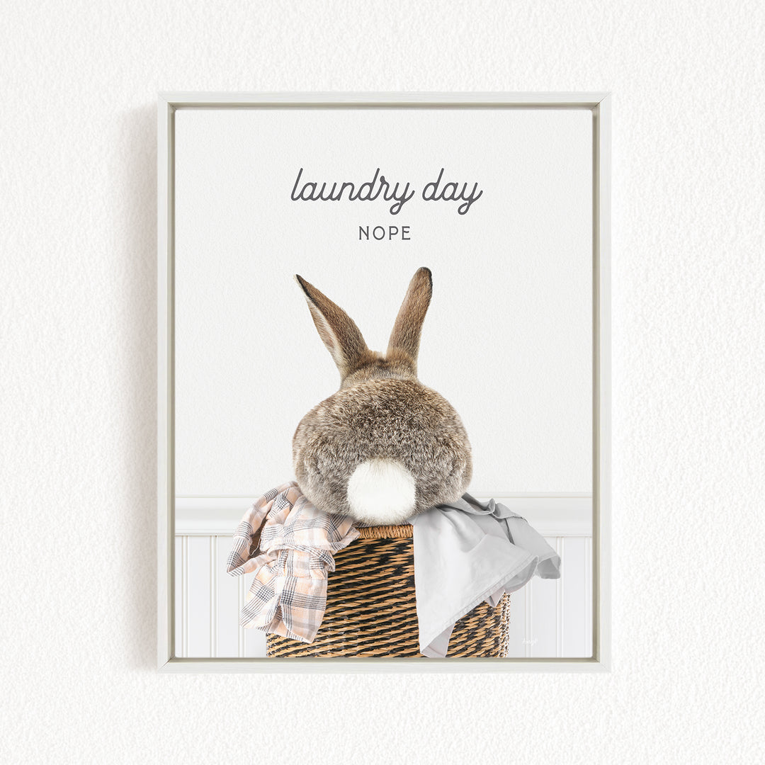 A picture of a rabbit sitting in a basket, with the text "laundry day NOPE" above it.
