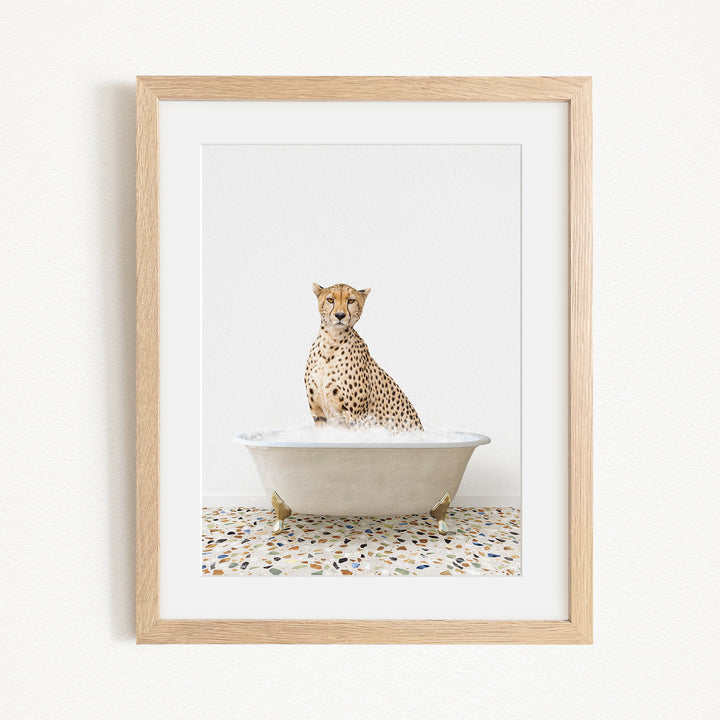 A cheetah sitting in a bathtub filled with water, creating a playful and whimsical scene.