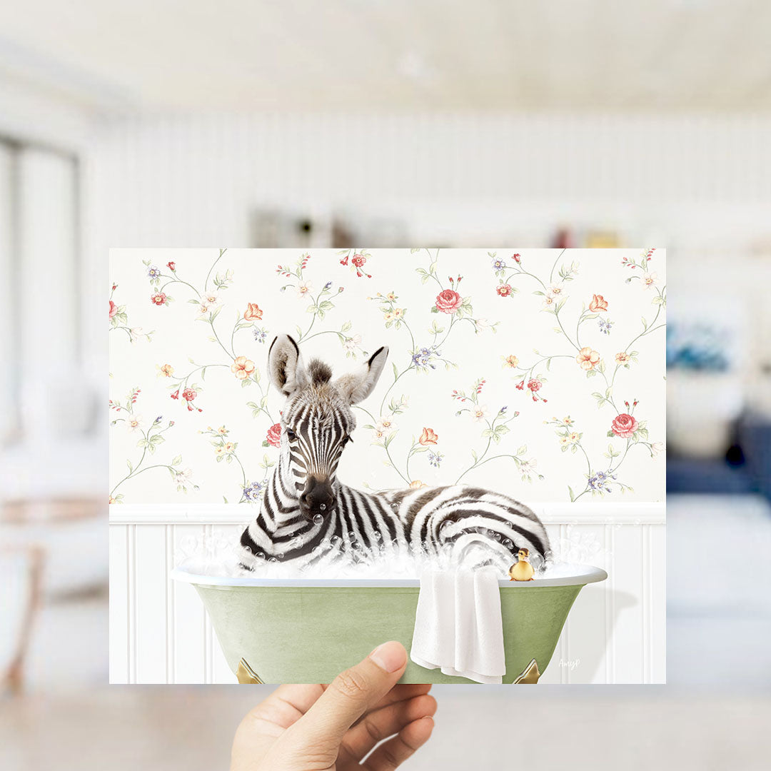 A zebra is sitting in a green bathtub, surrounded by a floral pattern on the wall behind it.