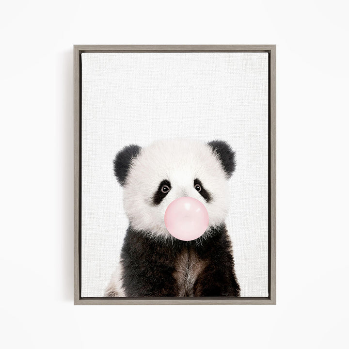 A cute panda bear blowing a bubble with a pink bubble gum bubble.