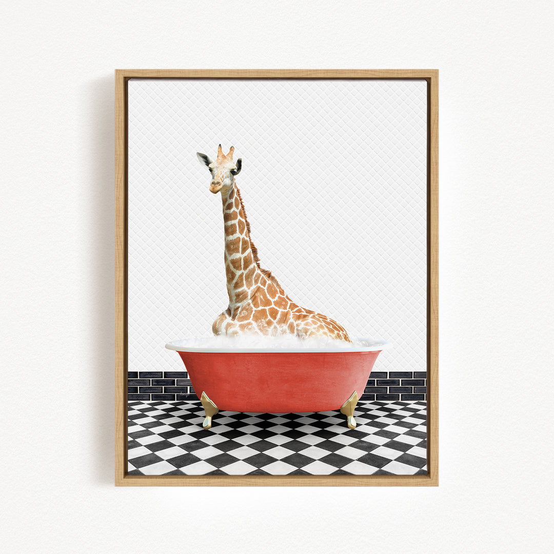 A giraffe sitting in a red bathtub on a black and white checkered floor.