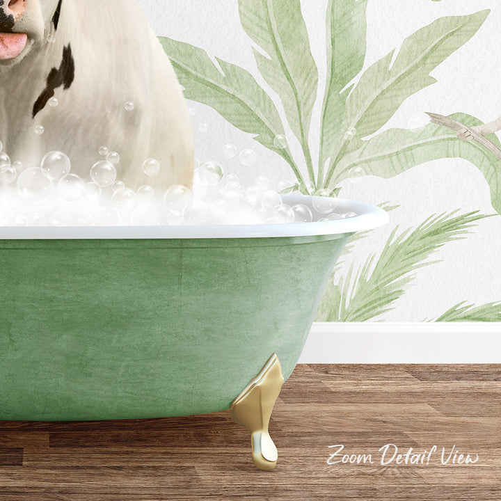 A white dog is sitting in a green bathtub filled with bubbles, with a tropical plant wall behind it.