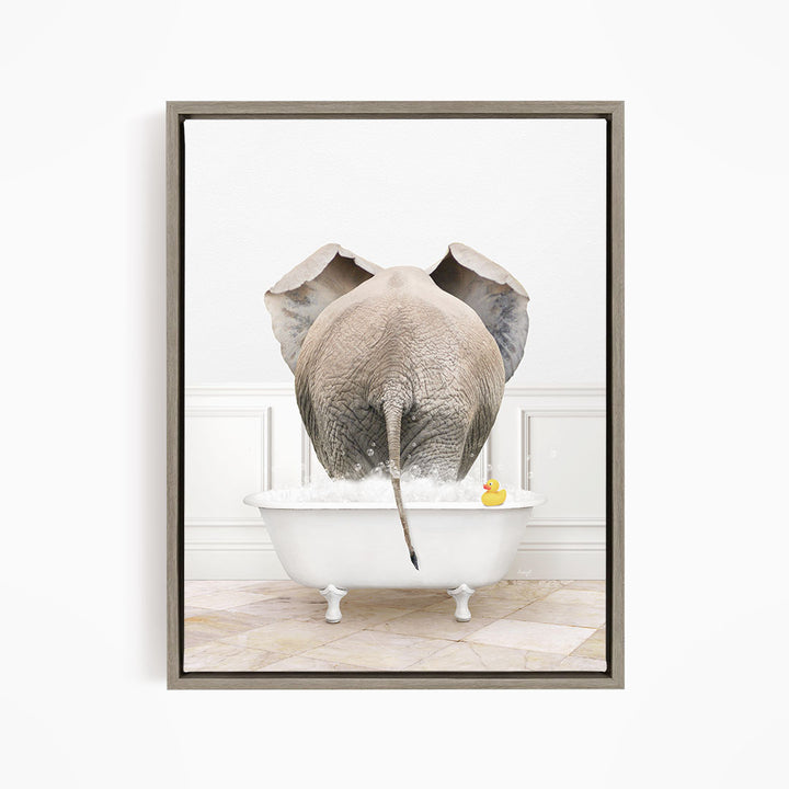 An elephant is standing in a white bathtub filled with water, with a rubber duck floating nearby.