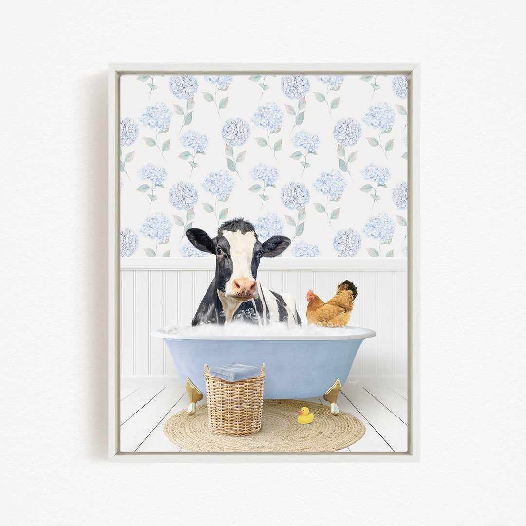 A black and white cow is sitting in a blue bathtub, surrounded by a chicken and a rubber duck, with a floral patterned wall behind them.