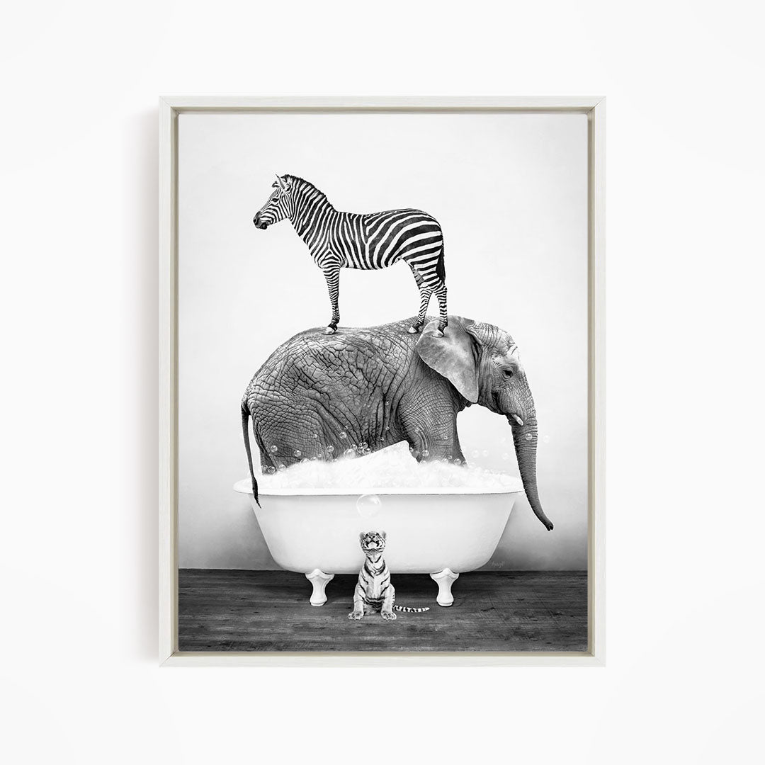 A zebra stands atop an elephant in a bathtub, with a small tiger sitting nearby.