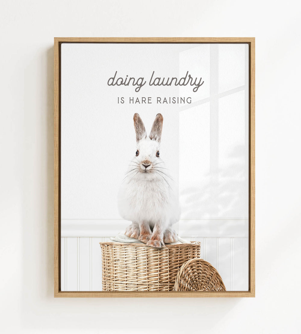 A white rabbit sitting on a woven basket, with the text "Doing laundry is Hare raising" displayed above the image.