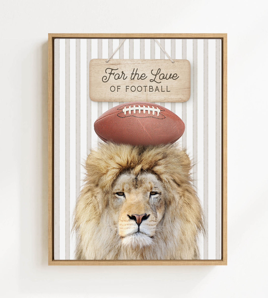 A framed image of a lion with a football on its head, accompanied by a wooden sign that reads "For the Love of Football".