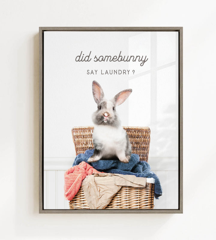 A cute rabbit sitting in a wicker basket filled with clothes, with the text "Did some bunny Say laundry?" displayed above the image.
