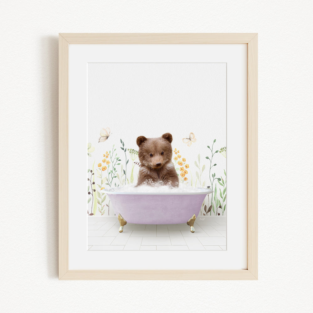 A cute brown bear sitting in a purple bathtub filled with bubbles, surrounded by flowers and butterflies.