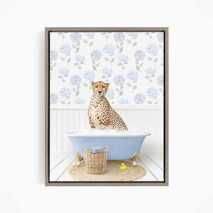 A cheetah sitting in a blue bathtub filled with water, surrounded by a wicker basket and rubber ducks.