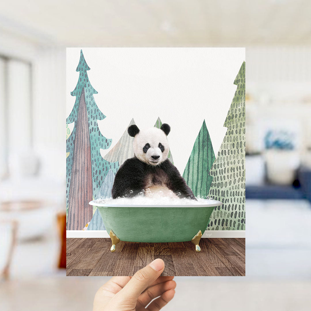 A panda bear sitting in a green bathtub, surrounded by trees and a snowy landscape.