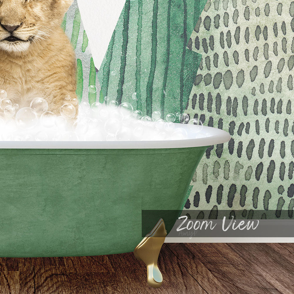 A cat is sitting in a green bathtub filled with bubbles, with a patterned wall in the background.