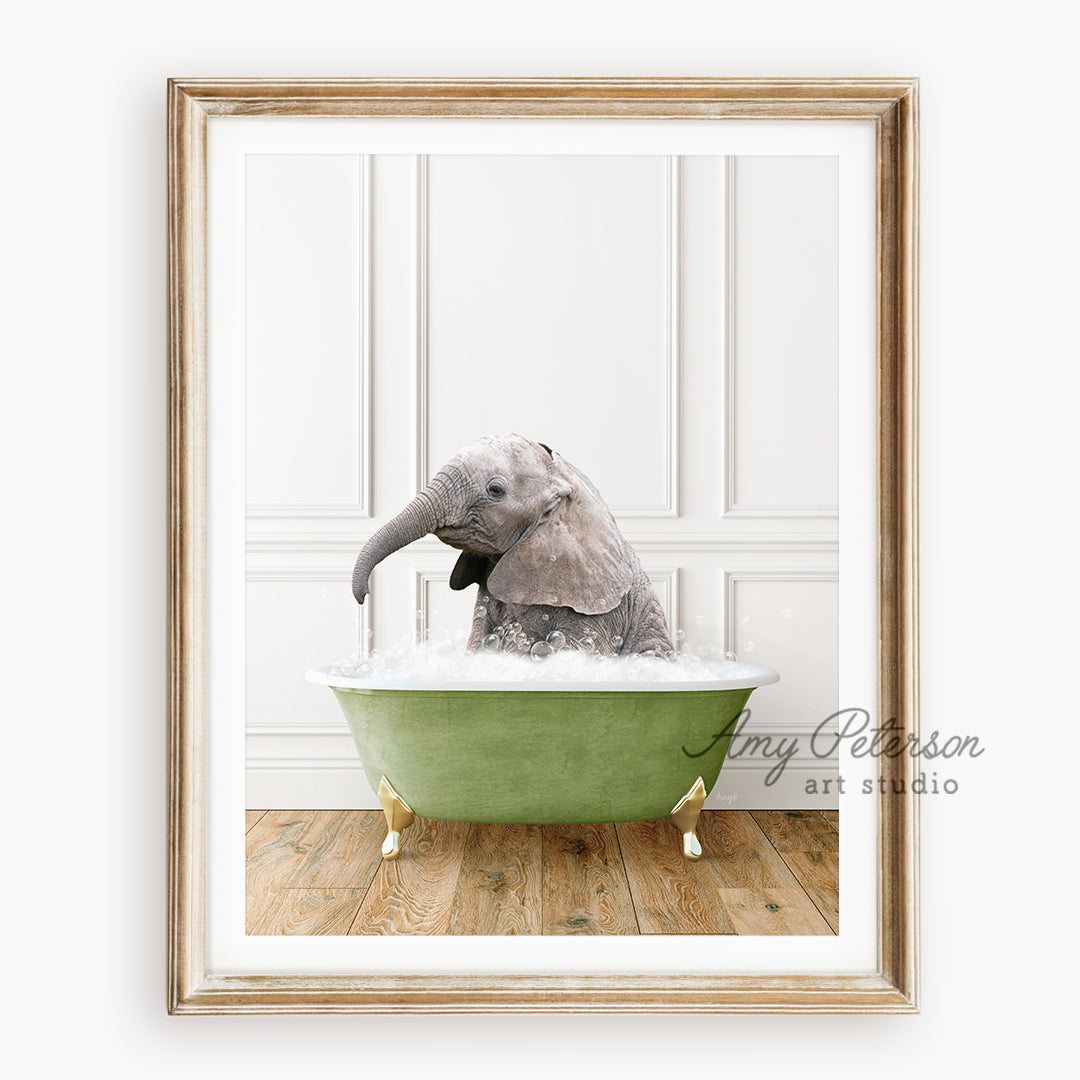 an elephant taking a bath in a green bathtub