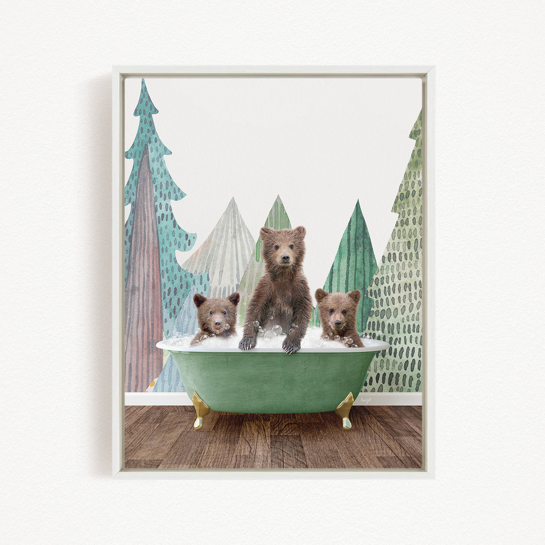 A framed print depicting three bears sitting in a green bathtub, with a forest scene in the background.