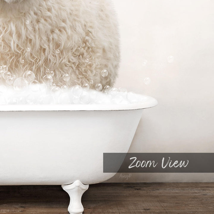A fluffy white dog is sitting in a white bathtub filled with bubbles, creating a playful and adorable scene.