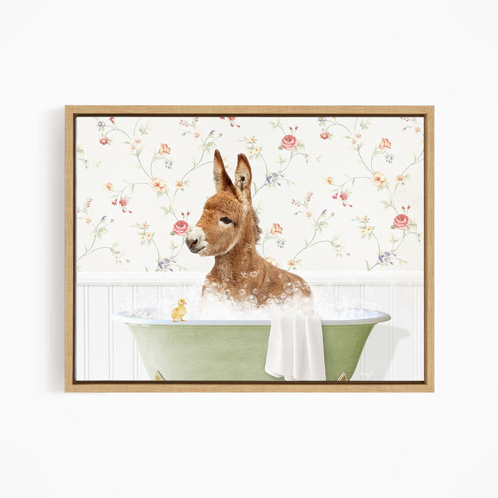 A brown donkey is sitting in a green bathtub filled with water, surrounded by a floral patterned wall.