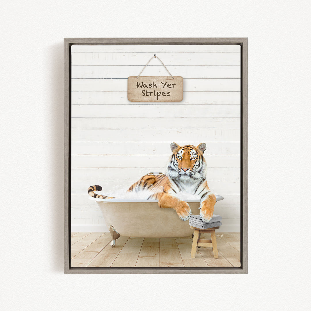 A tiger is sitting in a bathtub, with a sign above it that says "Wash Yer Stripes".