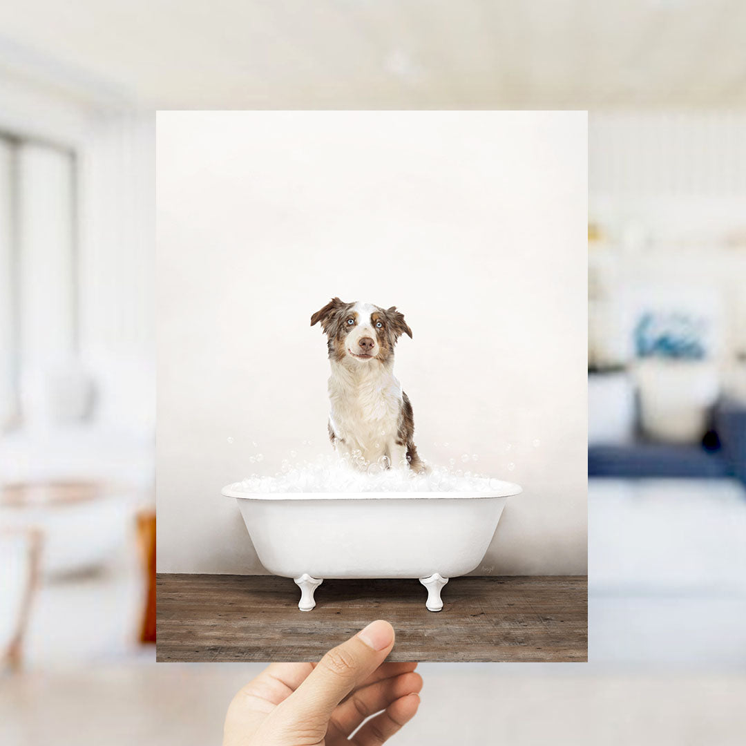 A small dog sitting in a white bathtub filled with water, with a blurred background suggesting a bathroom setting.