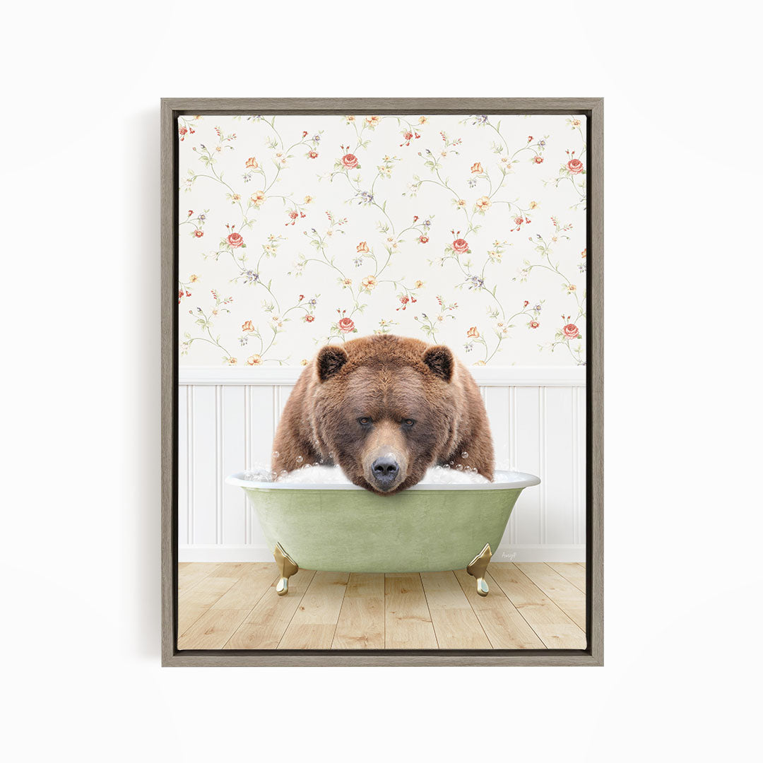 A brown bear is sitting in a green bathtub, appearing to be enjoying a relaxing bath.