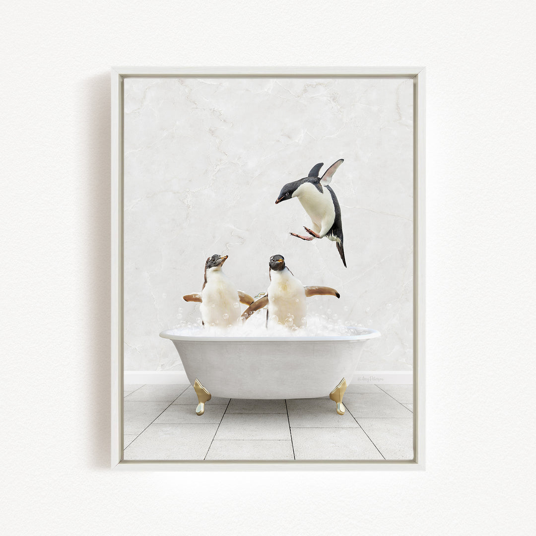 A framed image depicting two penguins sitting in a bathtub, with one penguin flying towards the other penguin.