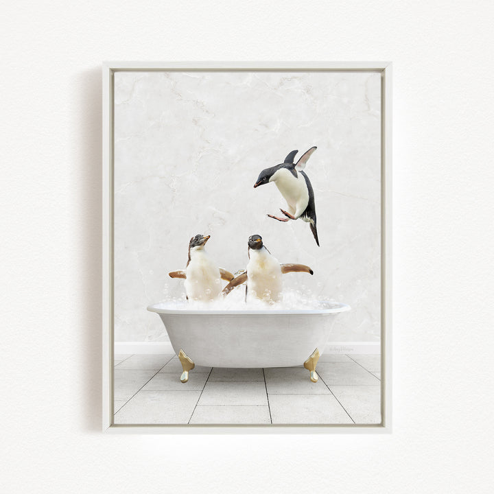 A framed image depicting two penguins sitting in a bathtub, with one penguin flying towards the other penguin.