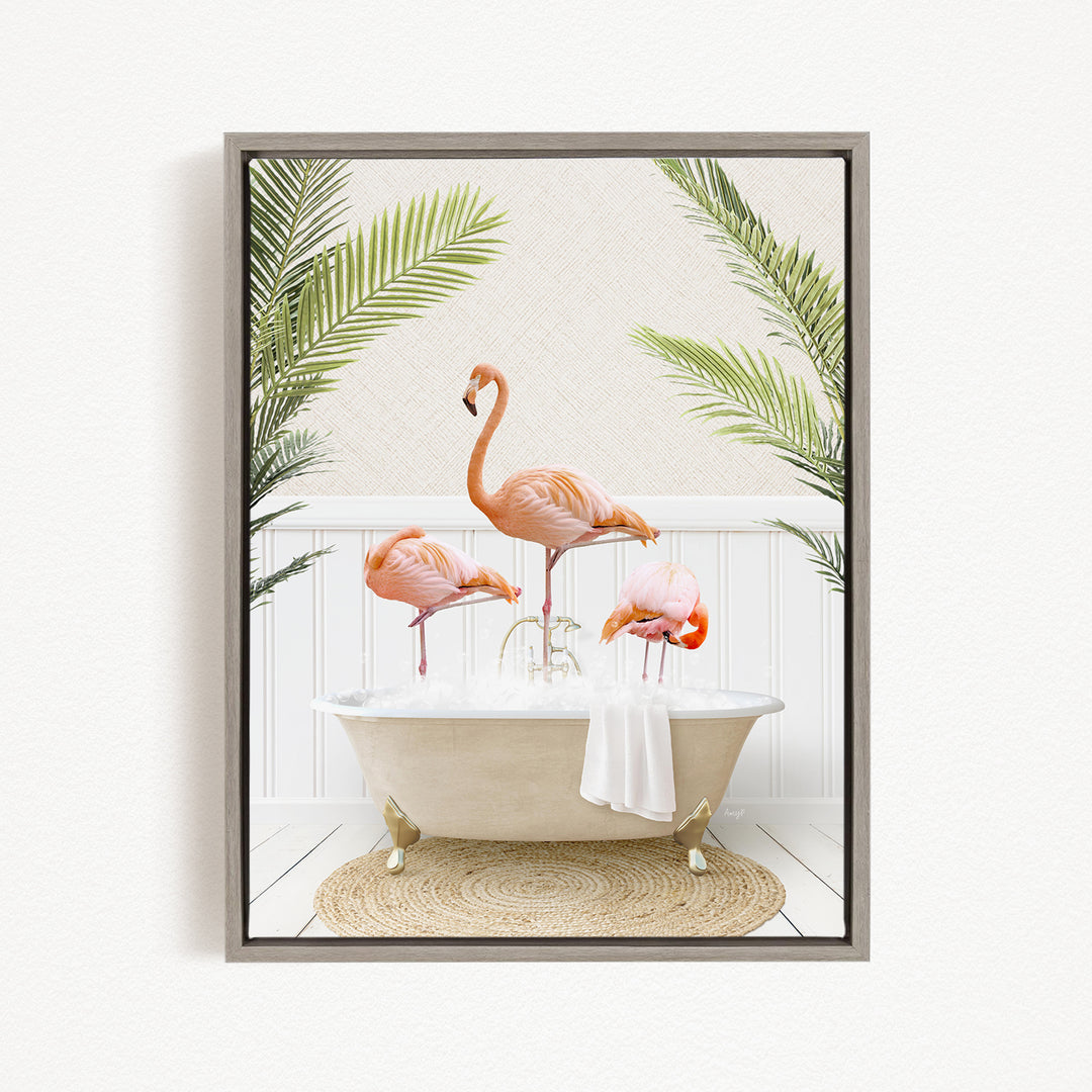 A framed image depicting three flamingos standing in a bathtub filled with water, surrounded by green palm leaves.