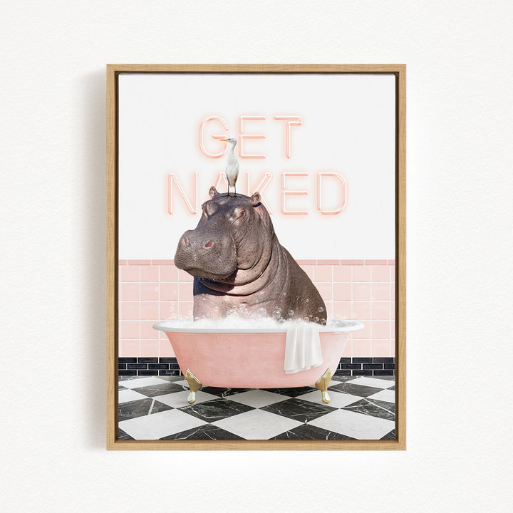 A framed image depicting a hippopotamus sitting in a pink bathtub, with a bird perched on its head. The text "GET NAKED" is displayed above the hippopotamus.