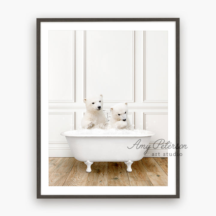 two small white dogs sitting in a bathtub