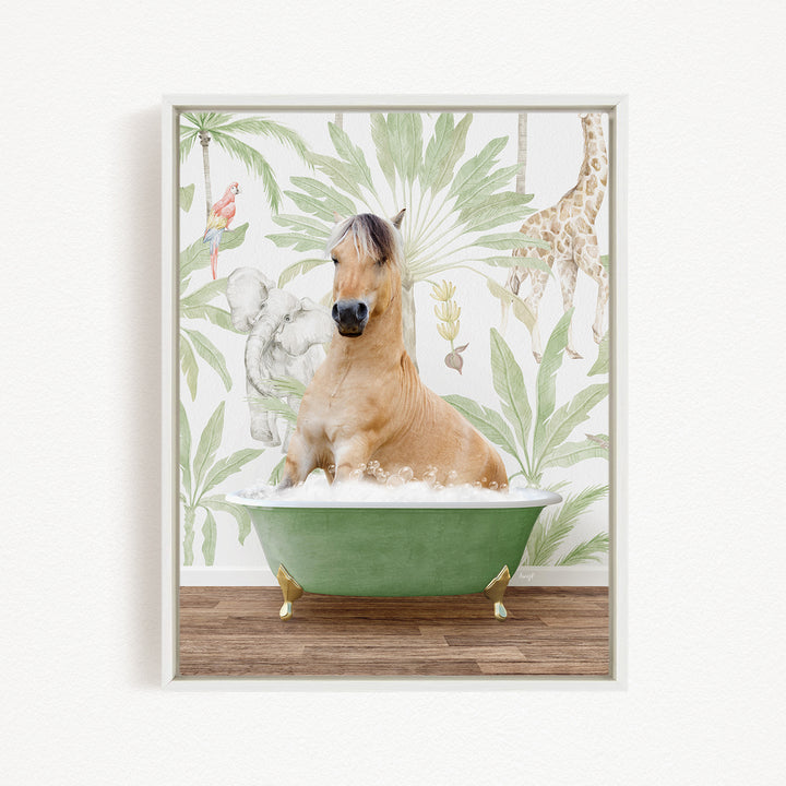 A light brown horse is sitting in a green bathtub, surrounded by tropical foliage and a giraffe in the background.