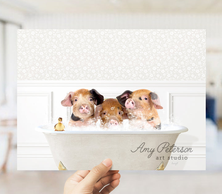 a person holding up a picture of three dogs in a bathtub