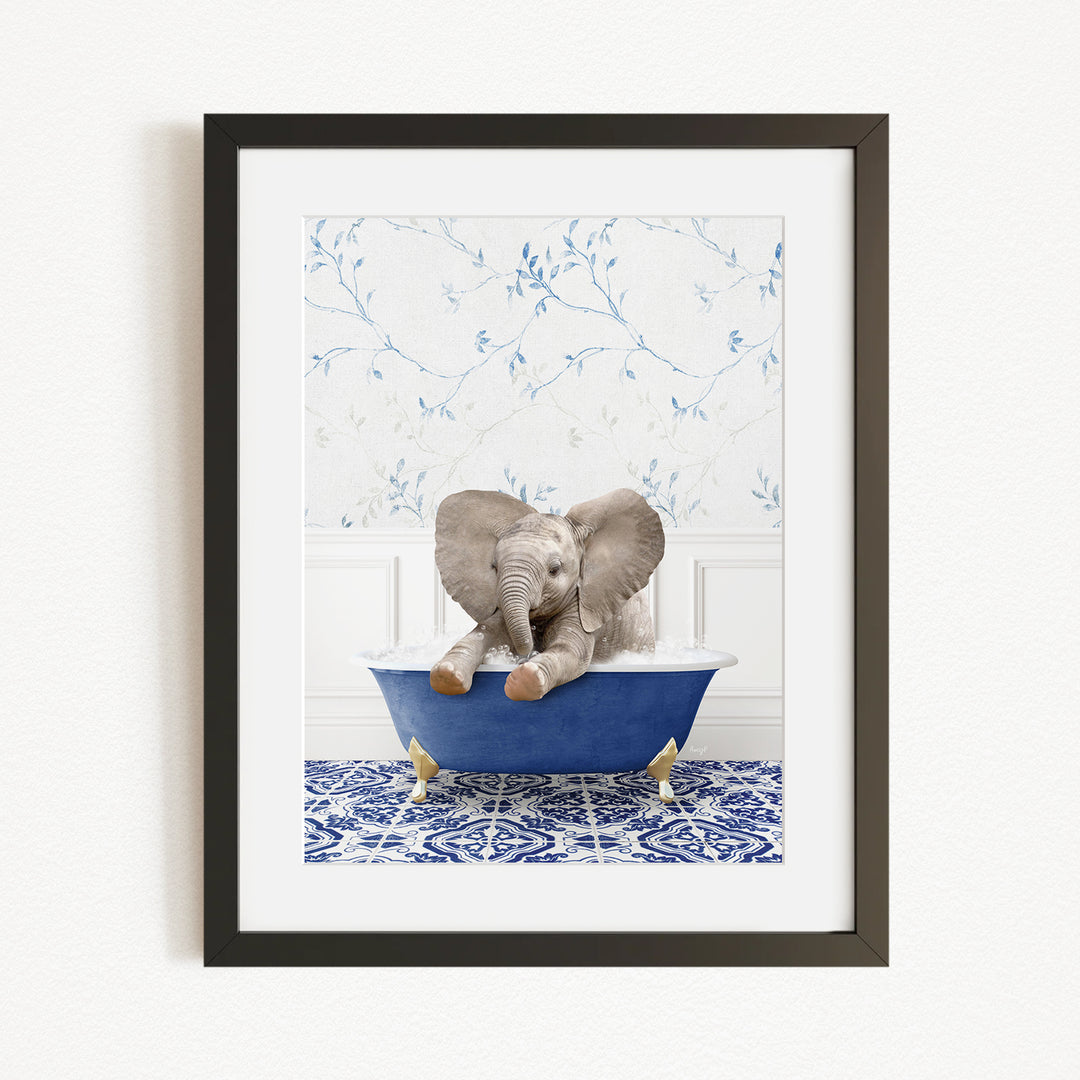 A baby elephant sitting in a blue bathtub, surrounded by a blue and white patterned rug and a white wall with blue floral wallpaper.