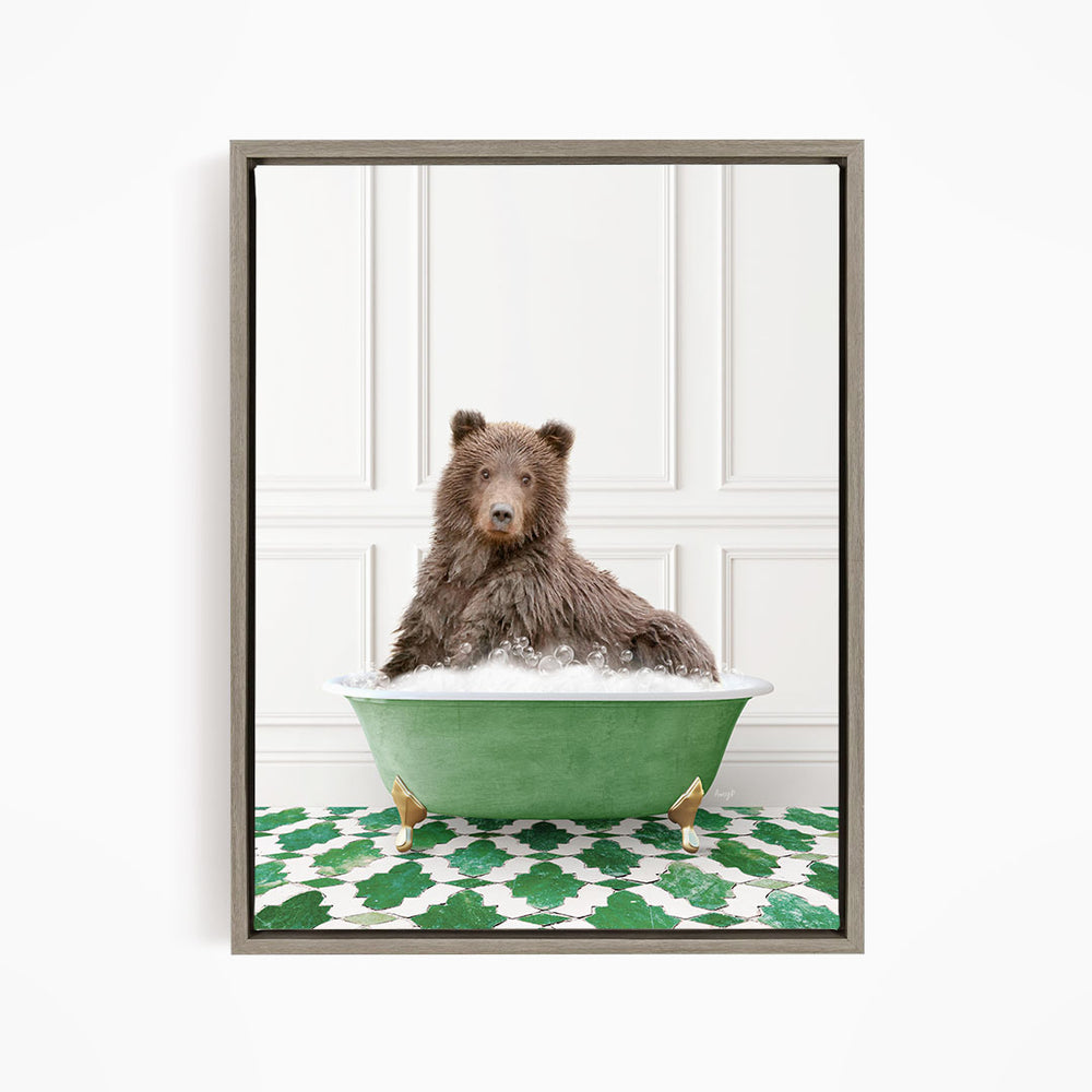 A brown bear sitting in a green bathtub filled with bubbles, with a green and white patterned floor in the background.