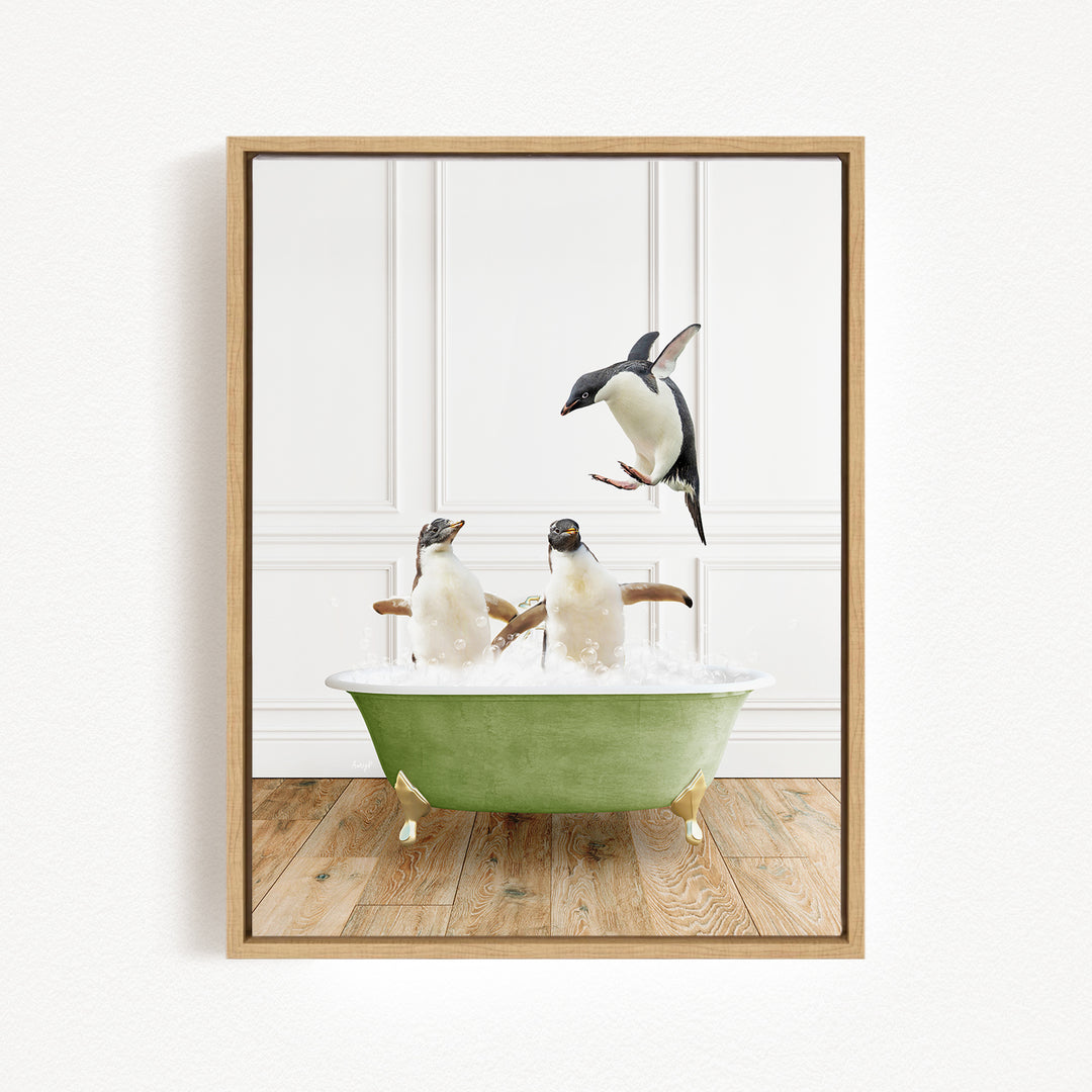 A framed image depicting two penguins sitting in a green bathtub, with one penguin jumping out of the tub.