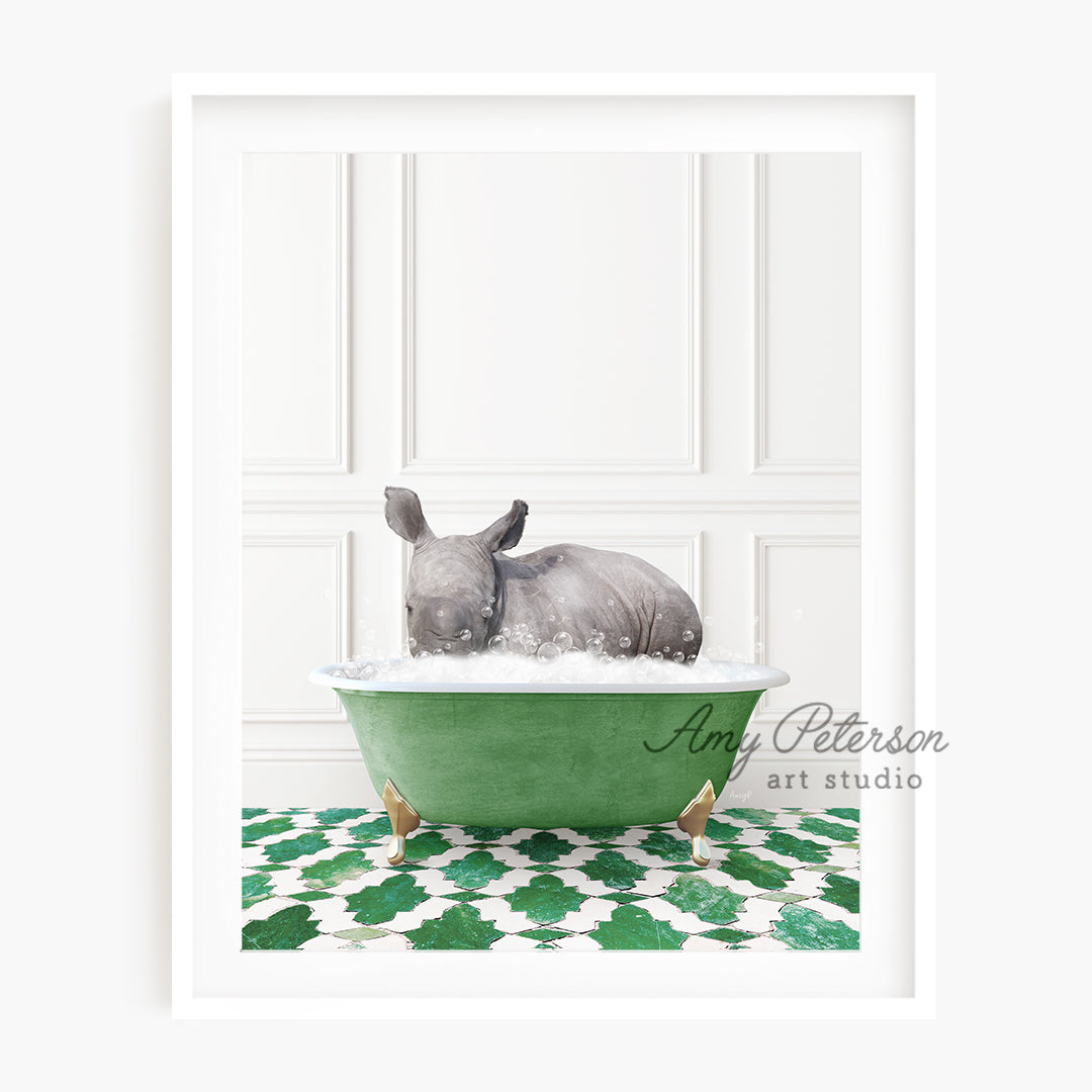 a baby rhino taking a bath in a green bathtub