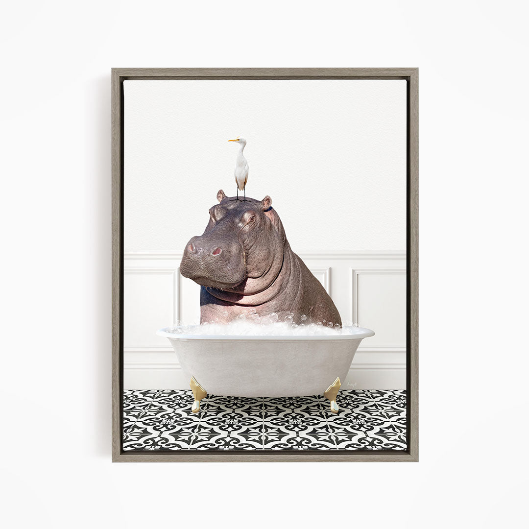 A large hippopotamus is sitting in a bathtub filled with water, with a seagull perched on its head.