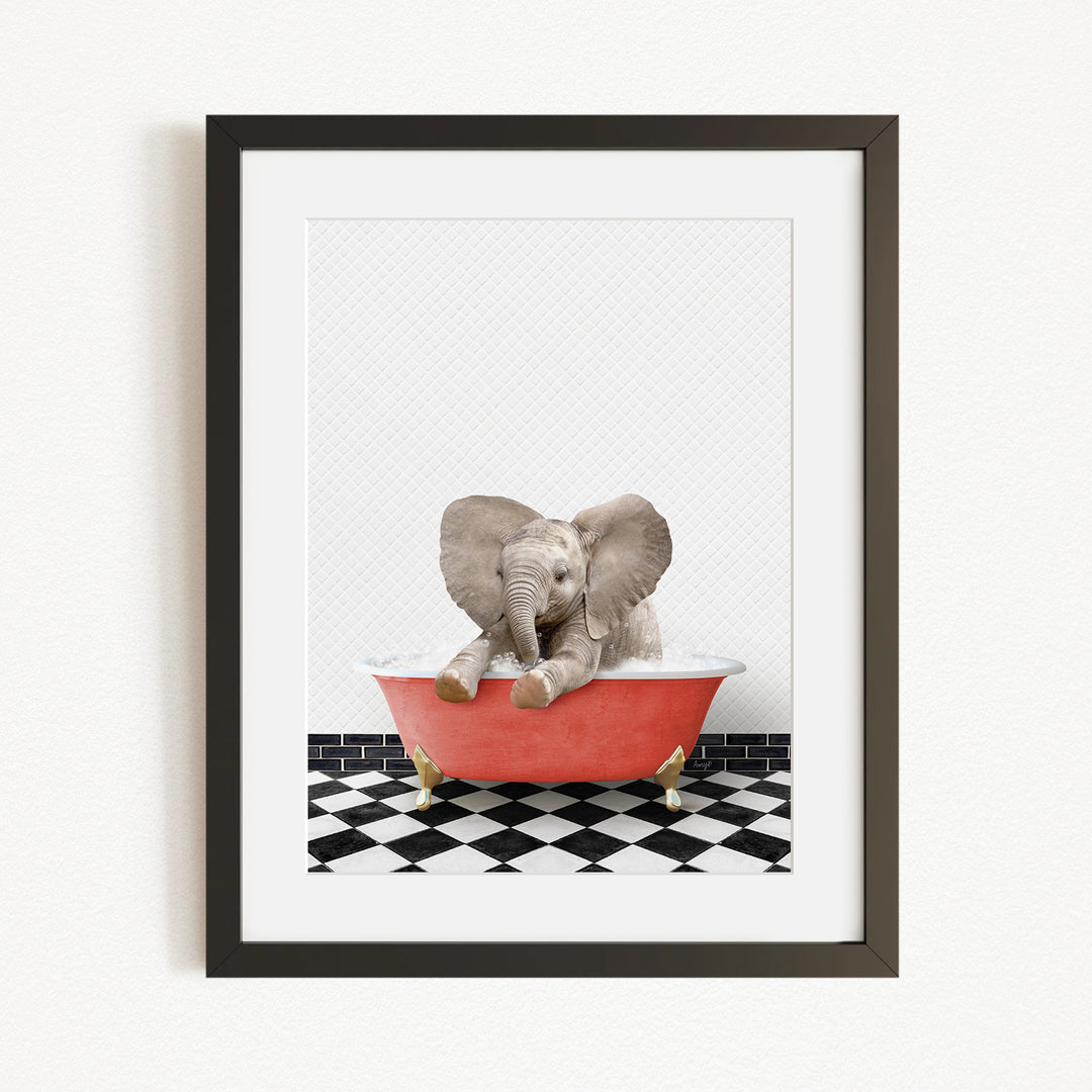 A baby elephant sitting in a red bathtub, surrounded by a black and white checkered floor.