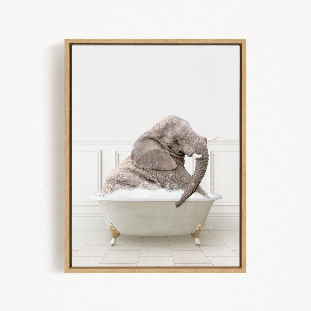 A gray elephant sitting in a white bathtub filled with water, with its trunk submerged in the water.