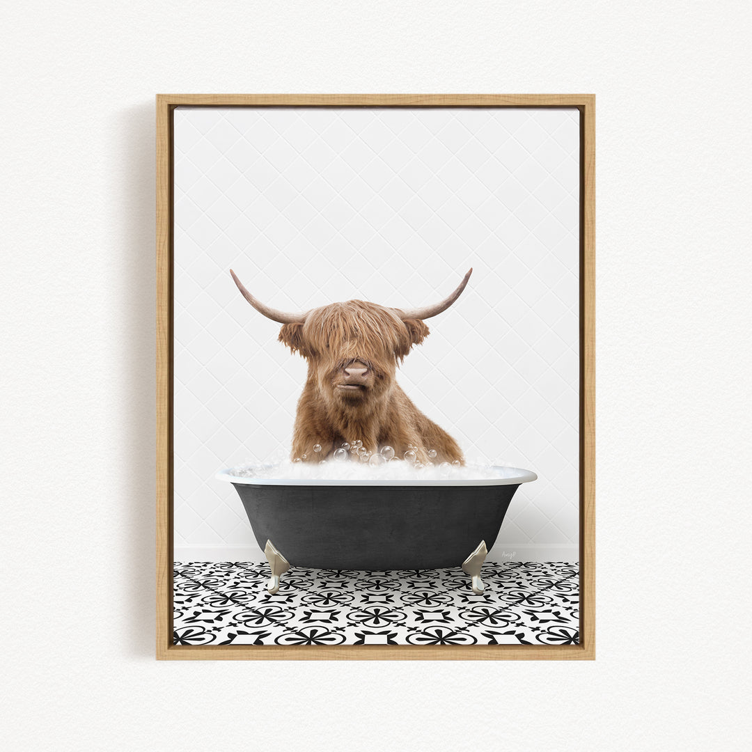 A Highland cow with shaggy brown hair is sitting in a black bathtub filled with water, creating a whimsical and playful scene.