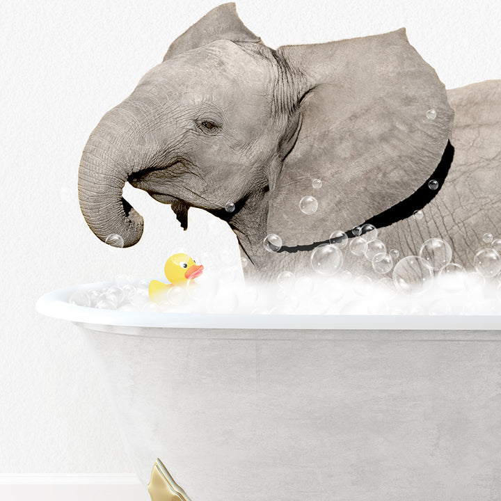 an elephant taking a bath with a rubber duck