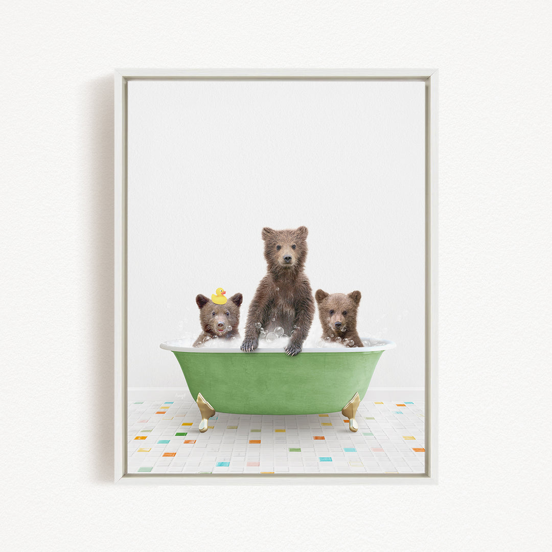 A framed image depicting three bears sitting in a green bathtub filled with water, with one bear standing and the other two sitting.