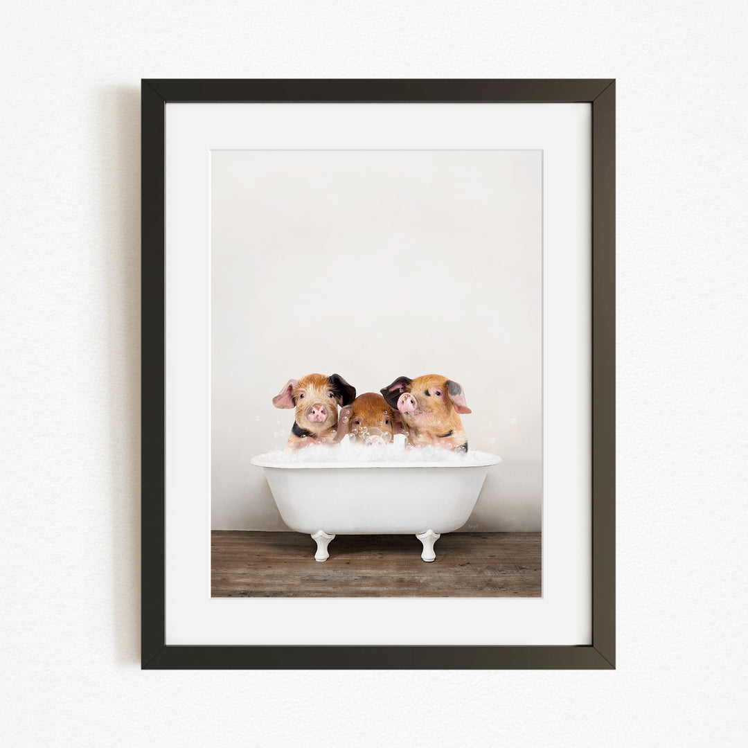 Three adorable pigs sitting in a white bathtub, enjoying a relaxing bath together.