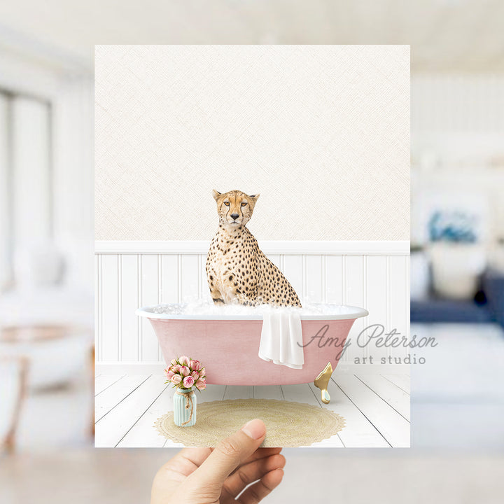 a person holding a card with a picture of a cheetah in a bath