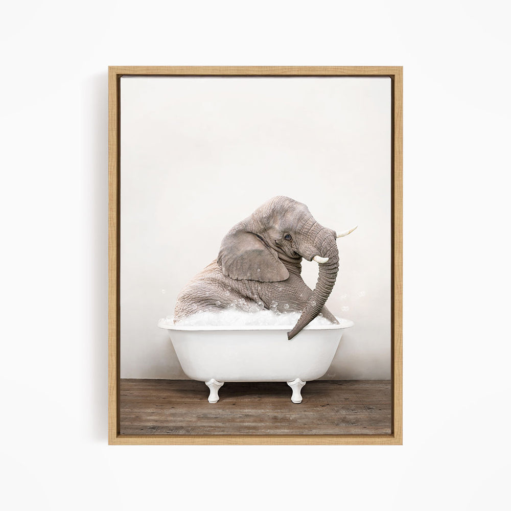 A gray elephant sitting in a white bathtub filled with water, creating a whimsical and playful scene.