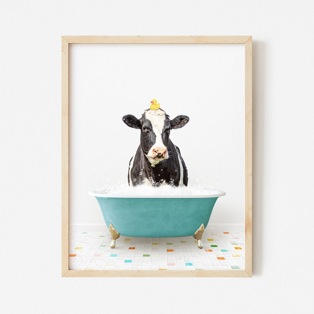 a black and white cow in a blue bath tub