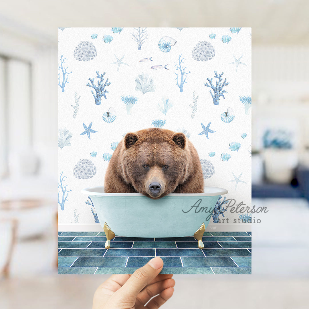 a hand holding up a card with a bear in a bathtub