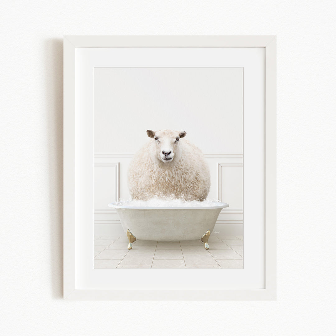 A fluffy white sheep sits in a white bathtub filled with bubbles, creating a whimsical and playful scene.